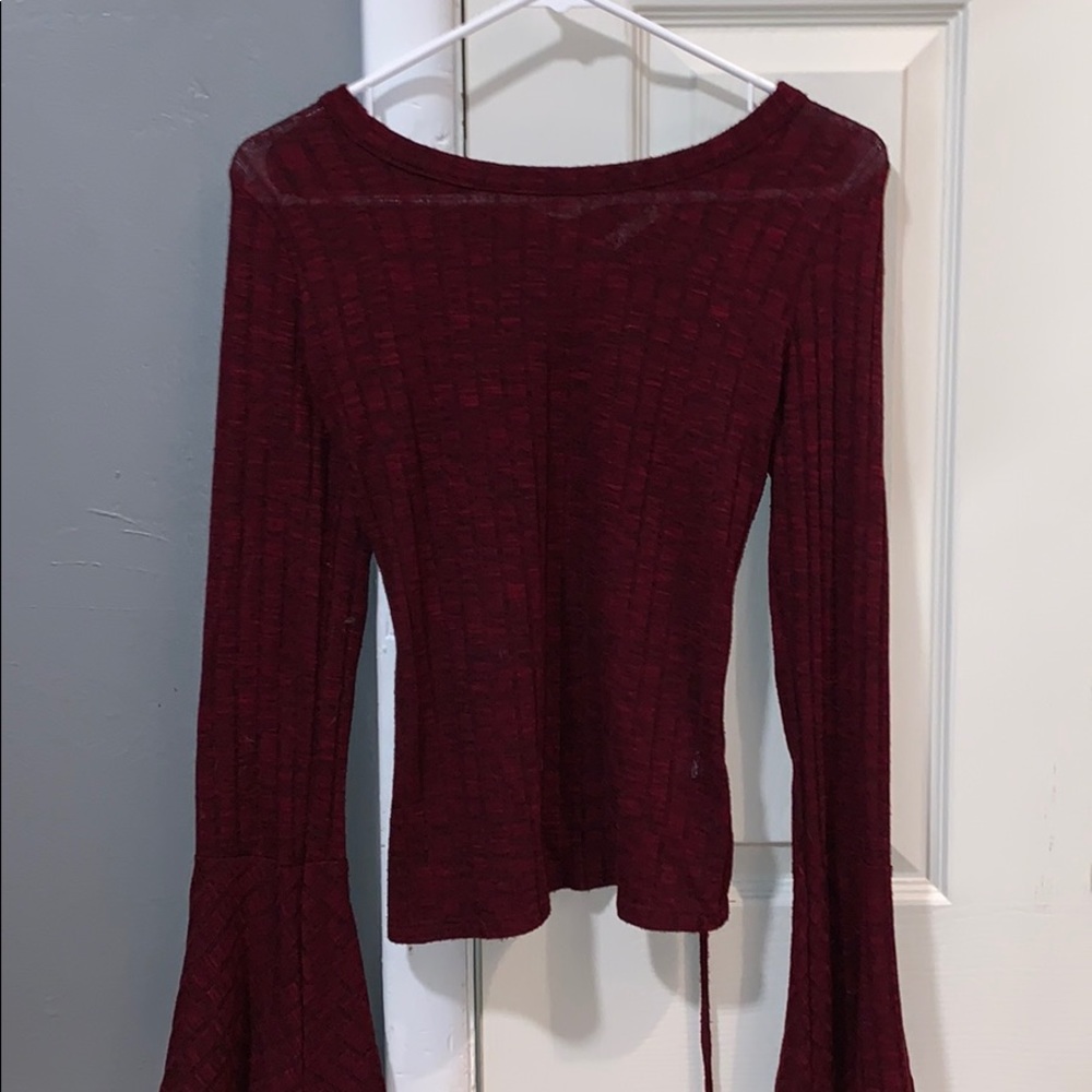 Burgundy long sleeve top with flared sleeves